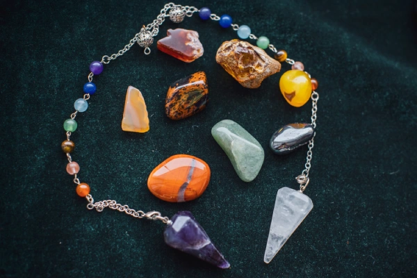 Colorful Assortment of Polished Gemstones on Dark Cloth